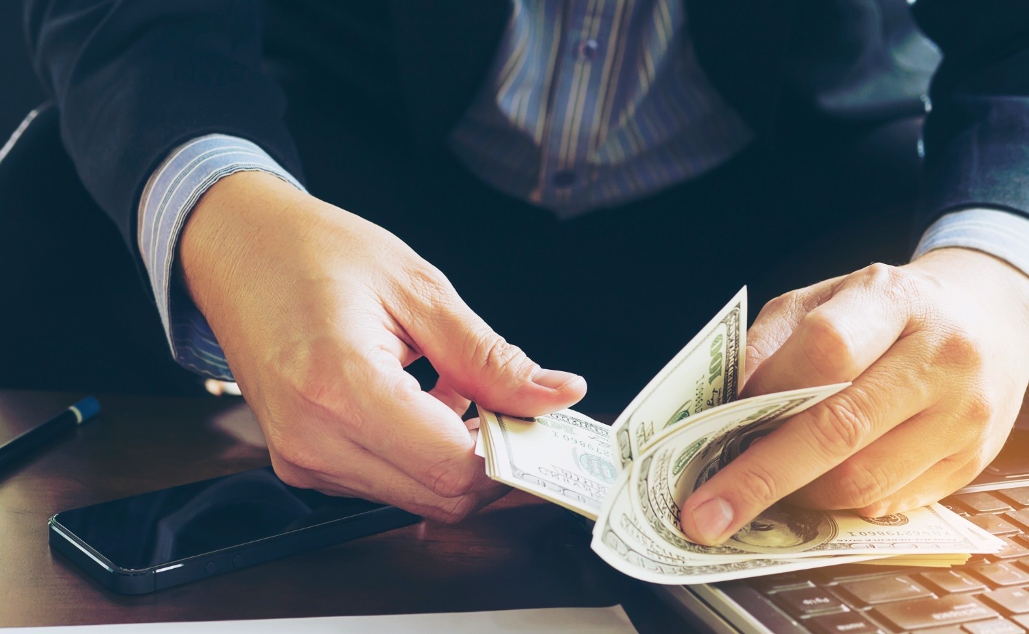 business-man-counting-dollar-banknote-online-business-concep
