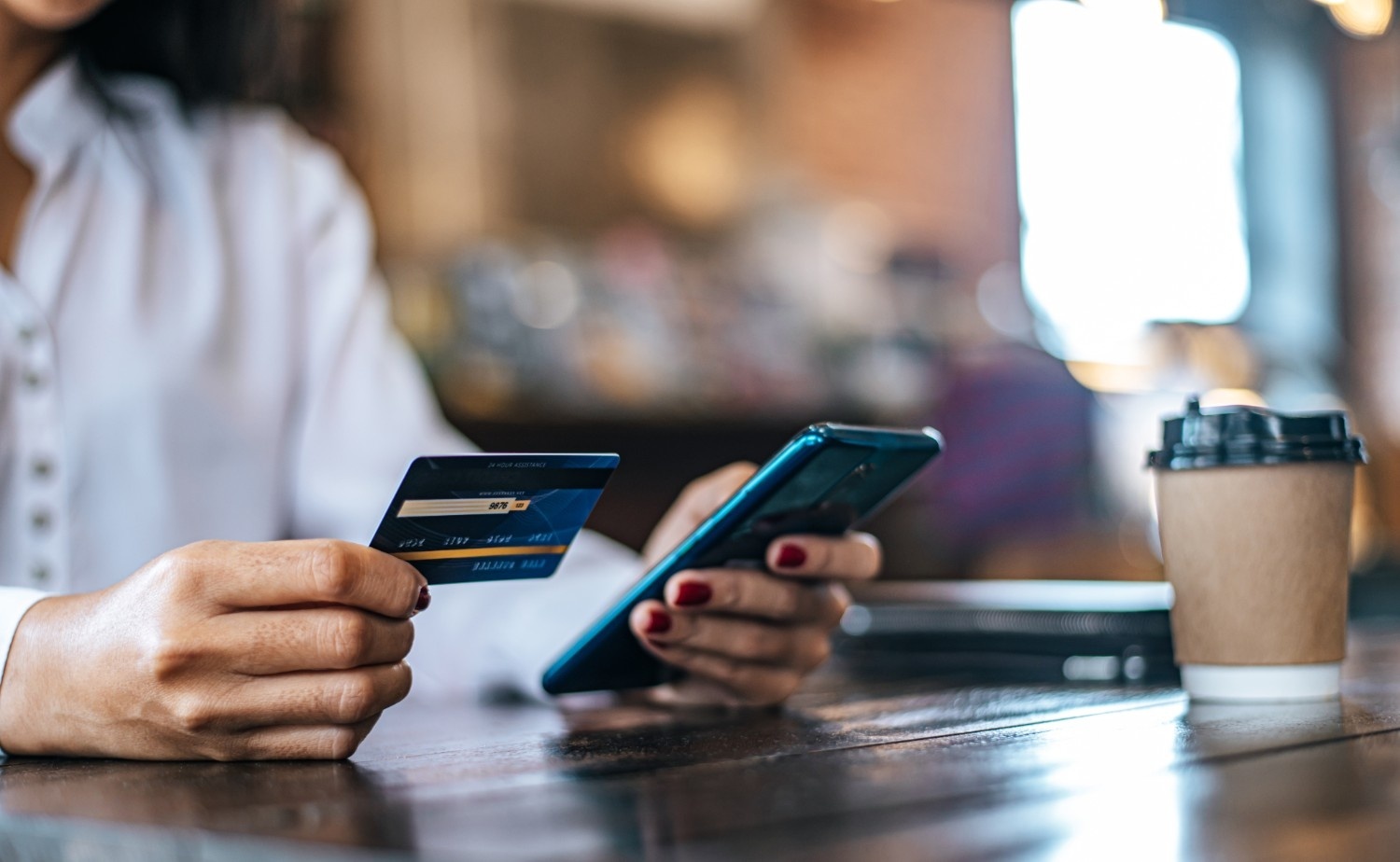 pay-goods-by-credit-card-through-smartphone-coffee-sho